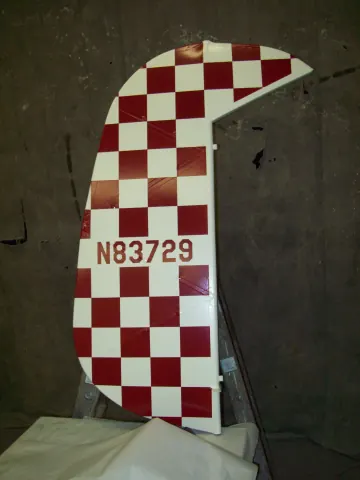 Checkerboard aircraft tail with registration number